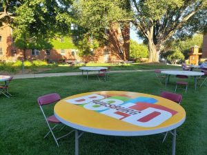 tables arranged in the quad read Augsburg Bold